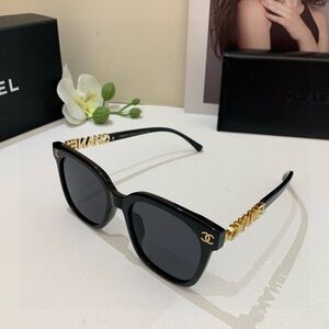 CHANEL Black Sunglasses with Gold Detailing